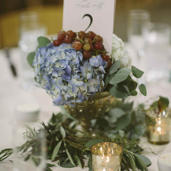 table decor, blue hydrangeas and grapes centerpiece, spruce mountain ranch reception, colorado wedding inspiration, mountain wedding planner