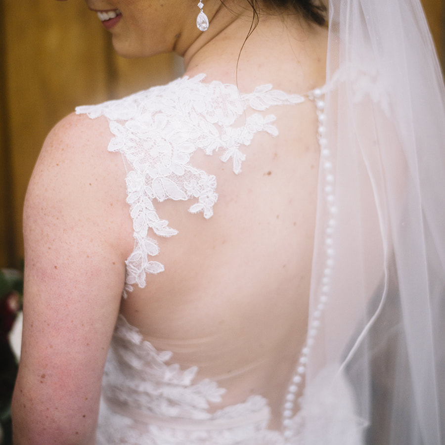 bride getting ready details, back of dress, veil, buttons and lace, cherokee ranch and castle, colorado wedding planning, mountain wedding inspiration