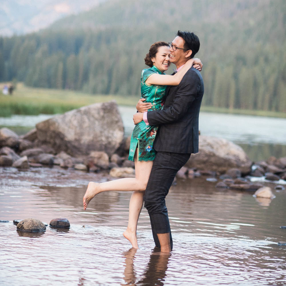 Bride and groom portrait barefoot in lake, taiwanese couple, piney river ranch wedding, mountain wedding planner, vail wedding planner, colorado wedding planner, sweetly paired, summer wedding inspiration, destination wedding planner