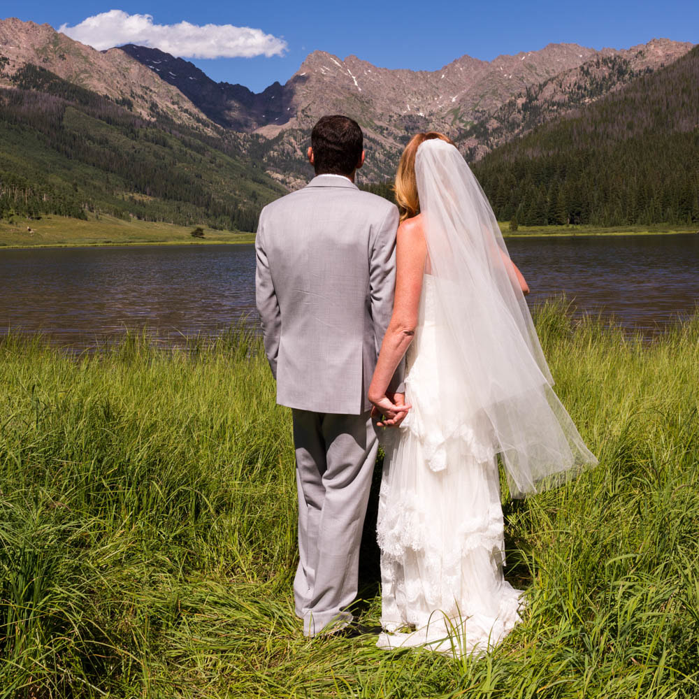 wedding mountain inspiration, beaver creek wedding planner, vail wedding planning, sweetly paired weddings, piney river ranch wedding venue, bride and groom portrait, holding hands