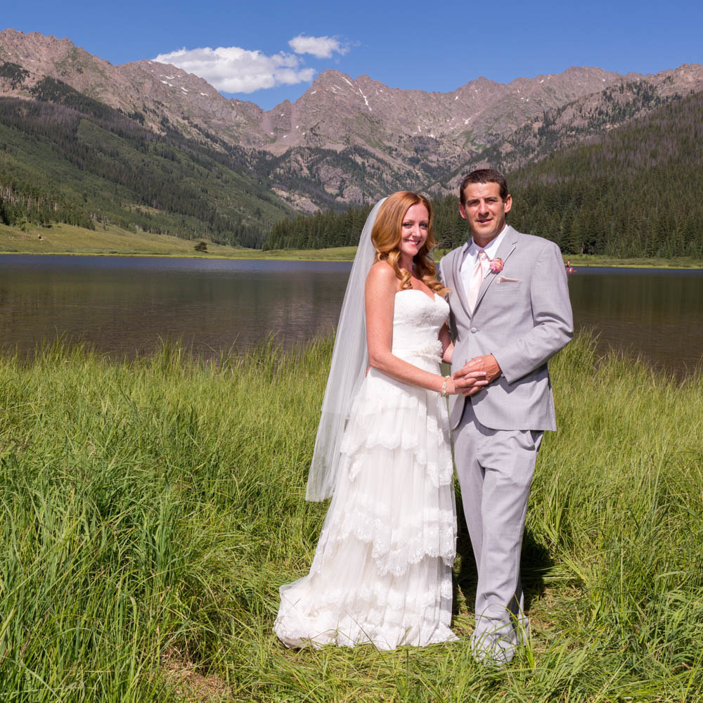bride and groom portrait in front of mountain lake, real weddings, piney river ranch wedding planner, colorado wedding planning, mountain wedding inspiration, vail wedding planners