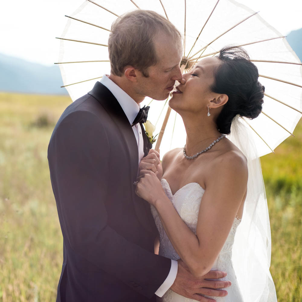 Bride and groom with parasol, boulder wedding planner, colorado wedding planner, classy formal real weddings, sweetly paired