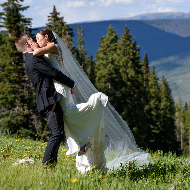 Bride and groom portrait, allie’s cabin, mountain top wedding, beaver creek wedding planner, colorado wedding planner, sweetly paired, mixed race couple, asian bride, groom lifting bride