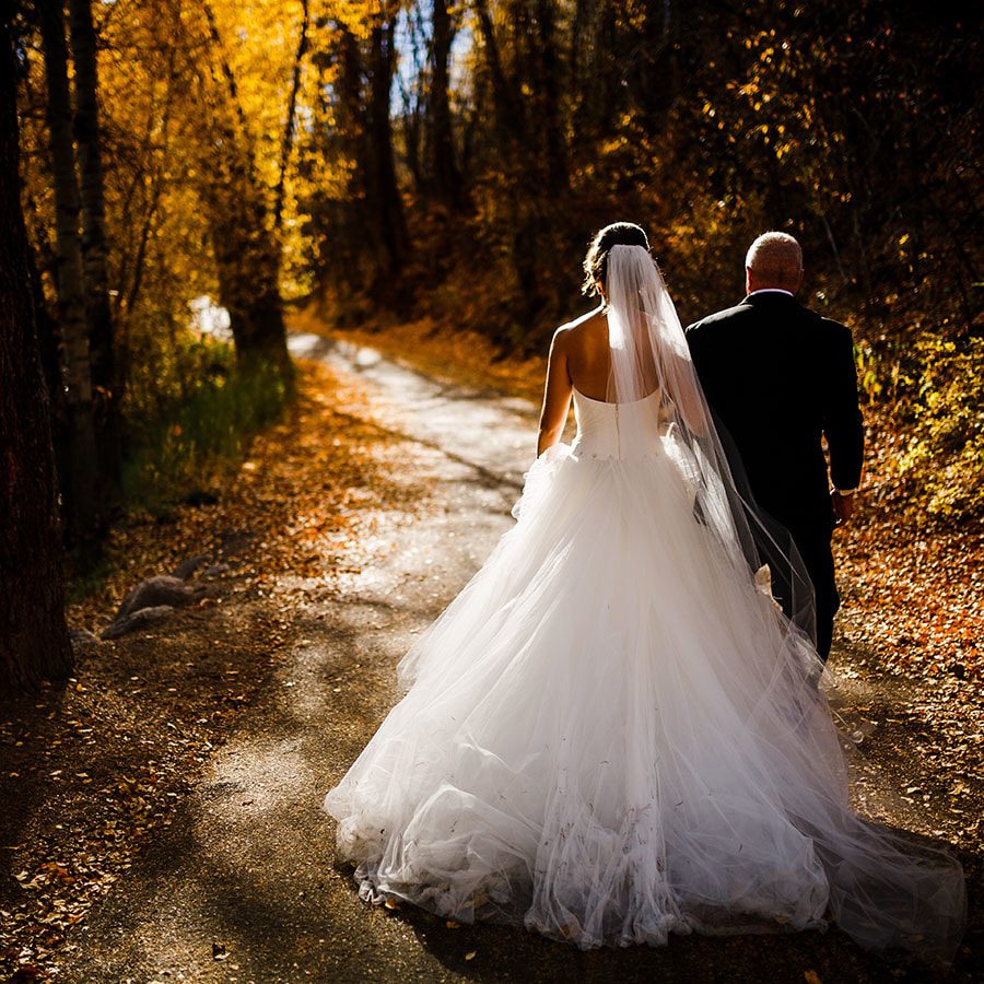 bride and groom walking holding hands, destination wedding planner, autumn mountain wedding inspiration, vail wedding planning, colorado wedding planner, sweetly paired weddings