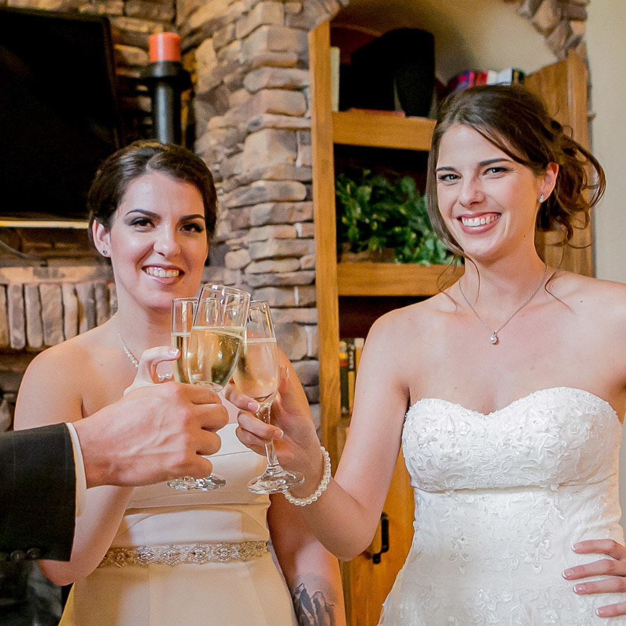 brides toasting champagne before ceremony at spruce mountain ranch, mountain wedding planning, colorado wedding inspiration, sweetly paired, lgbt wedding