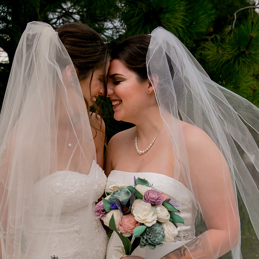bridal portrait, bride and bride lgbt couple, wooden bridal bouquets, intimate moment, spruce mountain ranch wedding planner, colorado real weddings, mountain wedding planner, sweetly paired