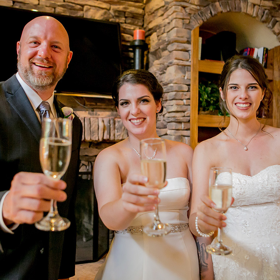 brides toasting champagne with wedding officiant, wedlock officiants, lgbt real weddings, colorado mountain weddings, mountain wedding inspiration, sweetly paired wedding planning
