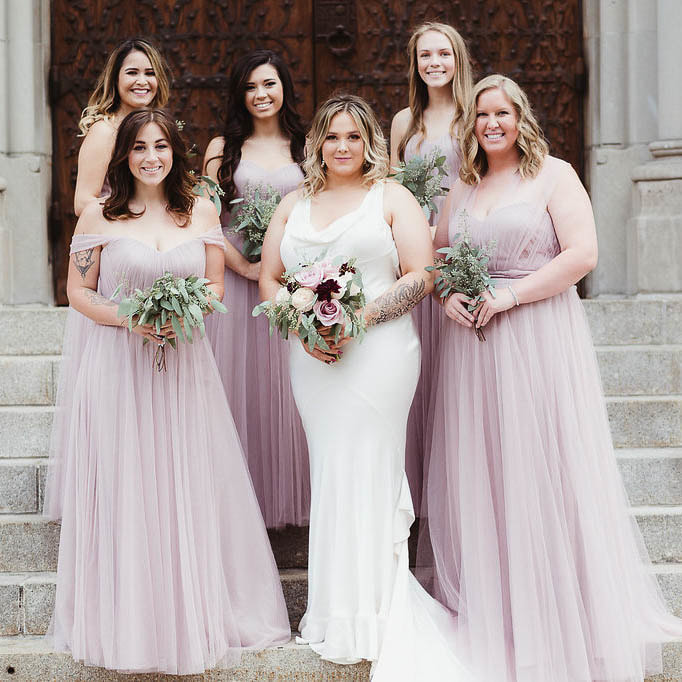 bride and bridesmaids on cathedral steps, blush bridesmaids gowns, Wedding party photos, the riverside church, new york city wedding planner, sweetly paired weddings, destination wedding