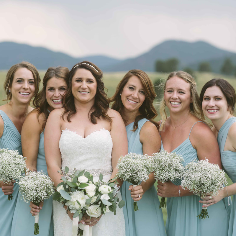 bridal party, bride and bridesmaids in robins egg blue dresses, white and green bouquets, spruce mountain ranch wedding planner, colorado real weddings, mountain wedding planner