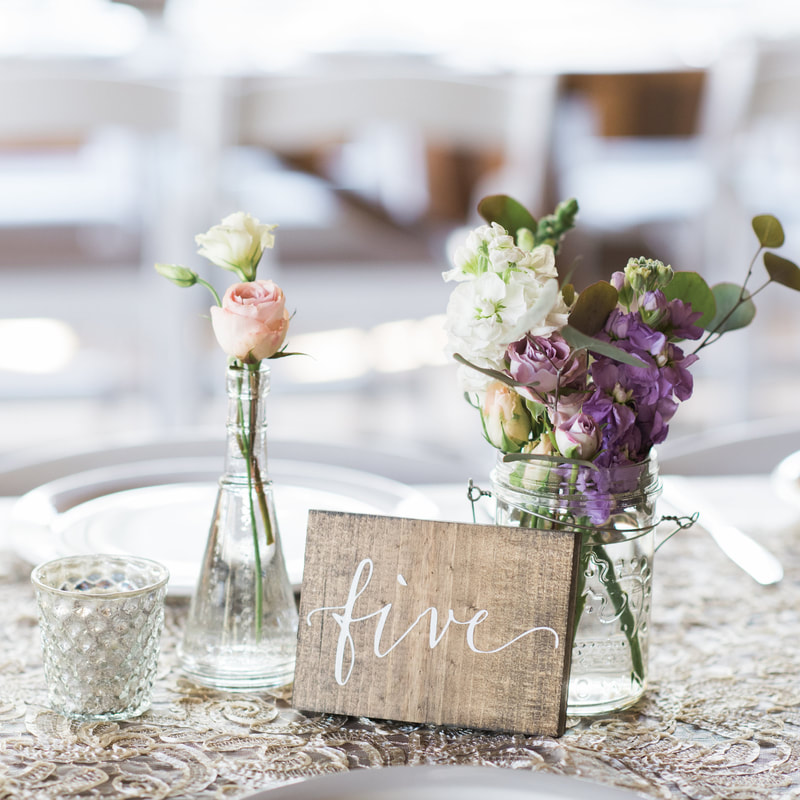 piney river ranch wedding reception, floral centerpieces, wooden table numbers, mountain wedding inspiration, vail wedding planners, beaver creek wedding planning