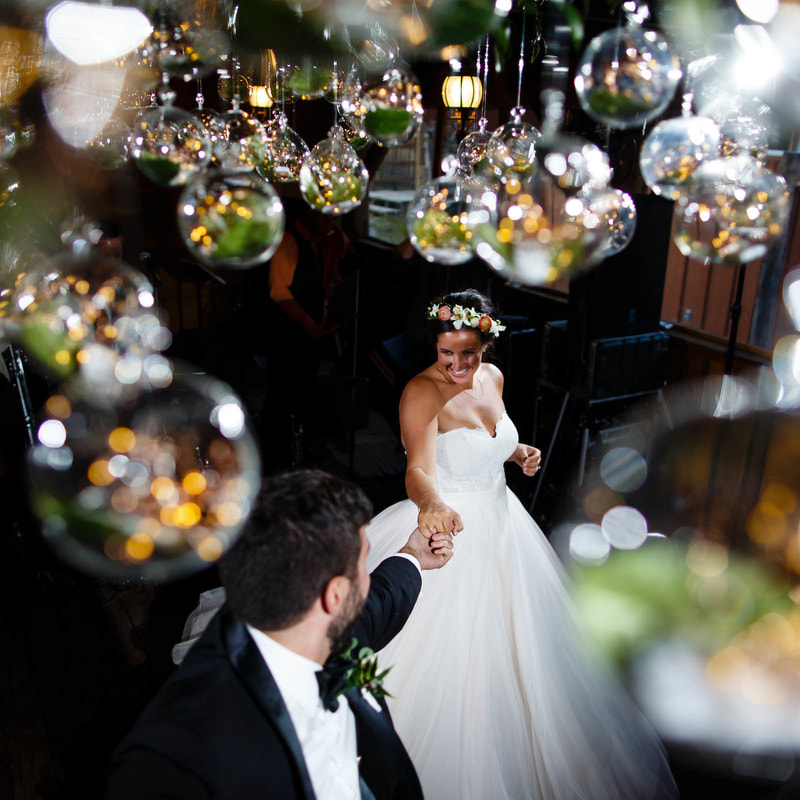 bride and groom dancing under edison bulb chandelier, reception at piney river ranch mountain wedding venue, colorado wedding inspiration, vail wedding planner, beaver creek wedding planner, sweetly paired weddings