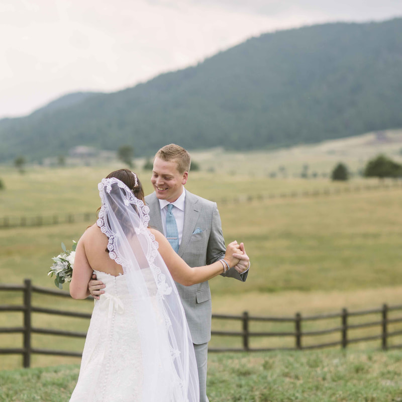 bride and groom first look in field at spuce mountain upper ranch, colorado wedding planning, mountain wedding inspiration