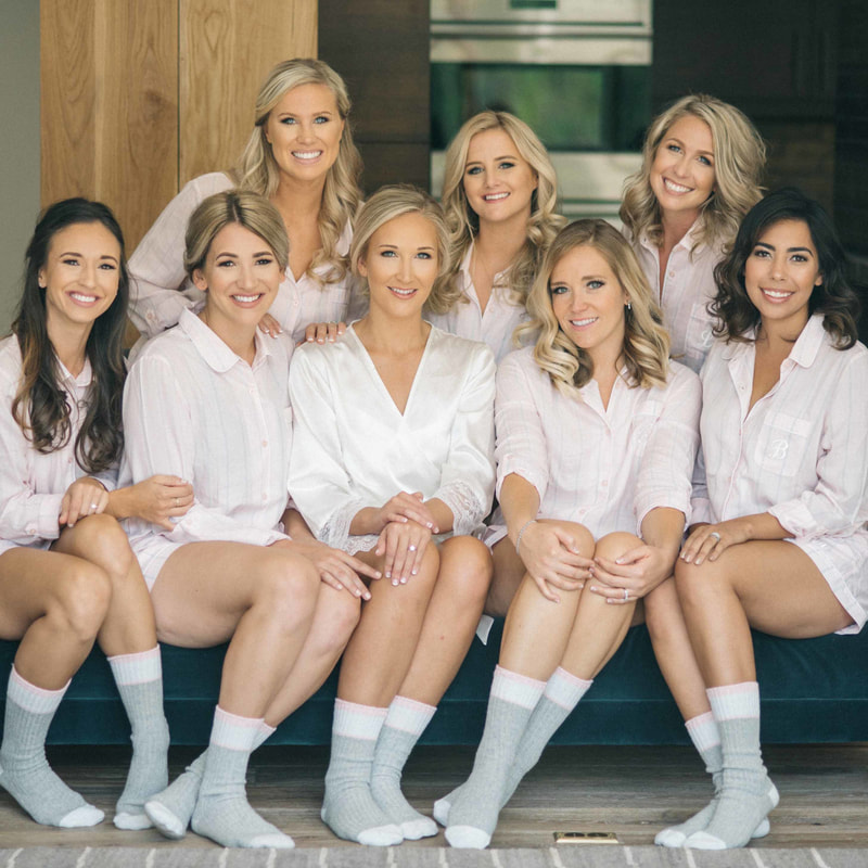 bridal party getting ready photos, bride and bridesmaids in matching white button down shirts and socks, colorado mountain weddings, beaver creek wedding inspiration