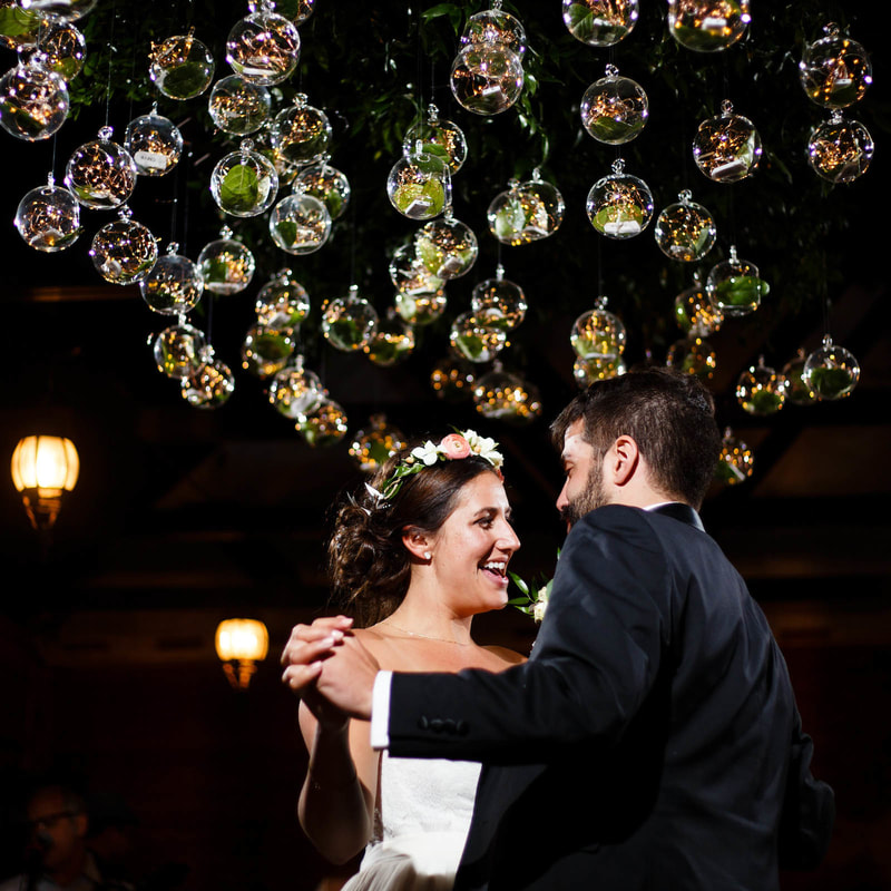 bride and groom dancing under edison bulb chandelier, reception at piney river ranch mountain wedding venue, colorado wedding inspiration, vail wedding planner, beaver creek wedding planner, sweetly paired weddings