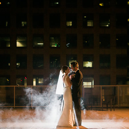 bride and groom night portrait on pool deck at westin denver downtown with fog, city wedding inspiration, denver wedding planner, sweetly paired weddings, winter wedding inspiration