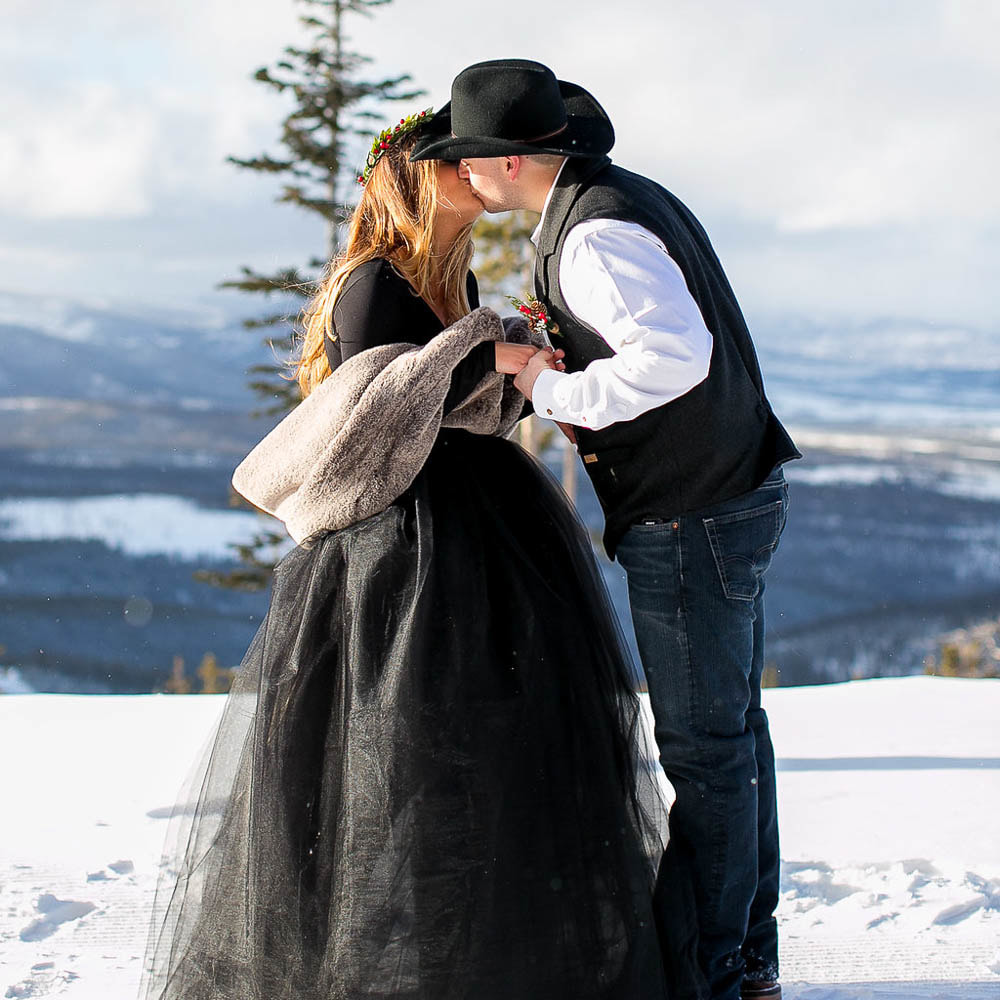 first kiss, Winter park resort mountaintop elopement ceremony venue, mountain wedding planner, winter wedding inspiration, sweetly paired wedding planning, destination wedding planners