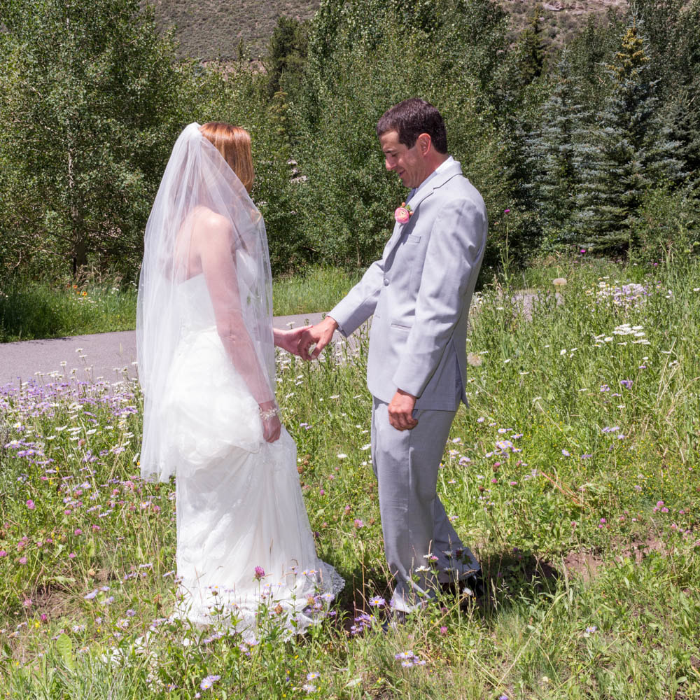 bride and groom first look at piney river ranch, glamping wedding, mountain wedding inspiration, vail wedding planners, sweetly paired weddings