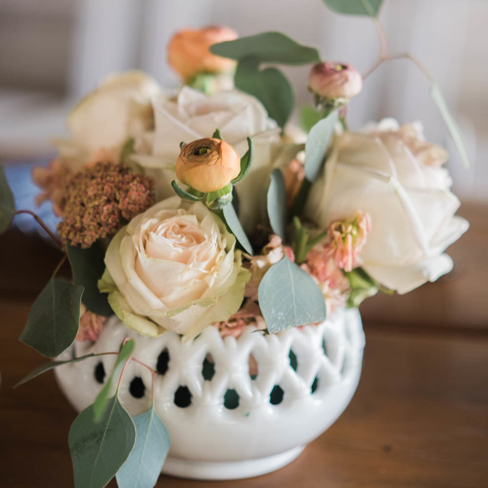 Peach and cream floral centerpieces in white milk glass vases, reception detail photos at piney river ranch, vail wedding planning, colorado wedding planner, destination wedding planner, sweetly paired weddings, mountain wedding inspiration, taiwanese wedding