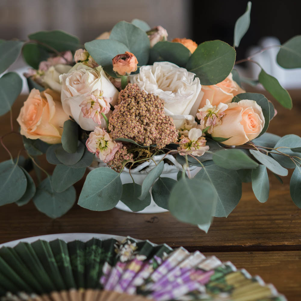 Reception decor, peach floral decor, traditional taiwanese wedding details, table setting with fan, mountain wedding planner, colorado wedding inspiration, sweetly paired wedding planning, piney river ranch wedding, head table floral centerpiece, asian wedding inspiration