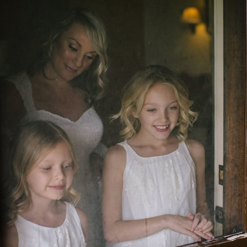 Bride getting ready for first look, standing in doorway with flower girls, denver wedding planner, colorado wedding planner, spruce mountain ranch alberts house
