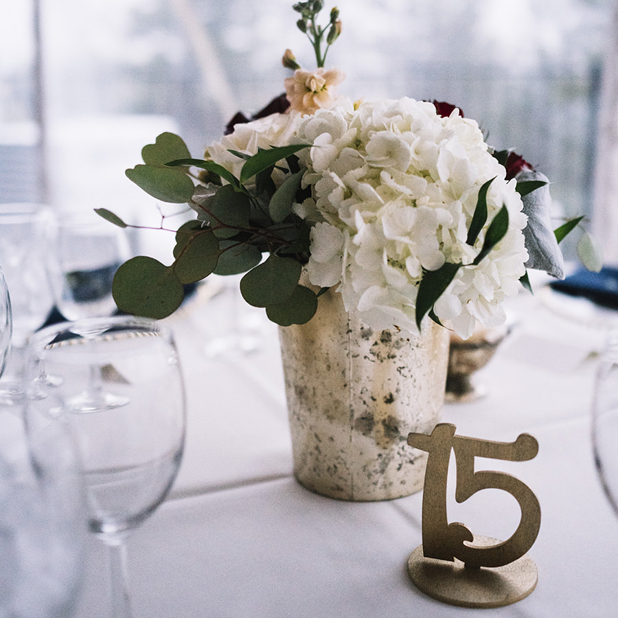 cherokee reception space, navy and gold, centerpiece, gold table numbers, colorado wedding planner, mountain wedding planning