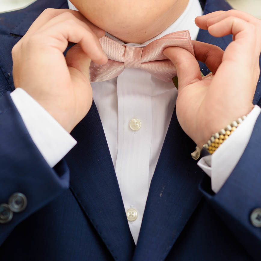 groom getting ready photo, detail photos, denver wedding planner, colorado wedding planner, navy suit with pink bow tie