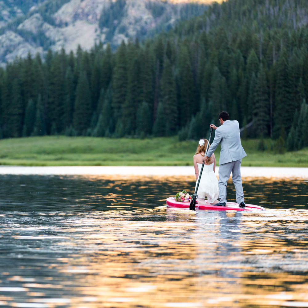 bride and groom rowing stand up paddle board, SUP, wedding mountain inspiration, beaver creek wedding planner, vail wedding planning, sweetly paired weddings, piney river ranch real wedding