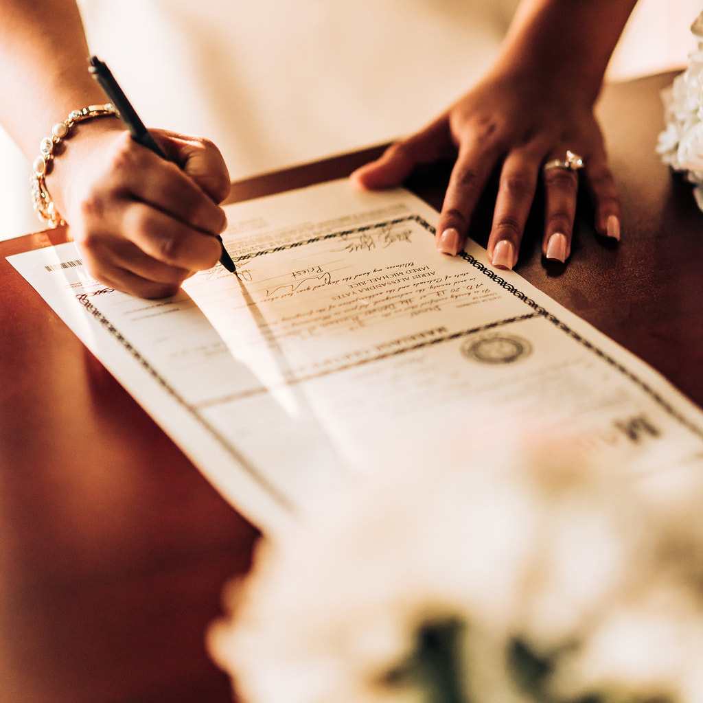 signing marriage license, detail photos, wedding reception at denver museum of nature and science, denver wedding planner, colorado wedding inspiration