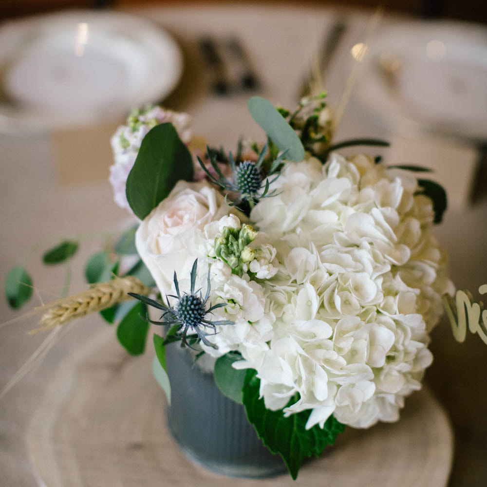 floral Centerpieces in metal vase, reception detail photos at spruce mountain ranch, denver wedding planning, colorado wedding planner, destination wedding planner, sweetly paired weddings