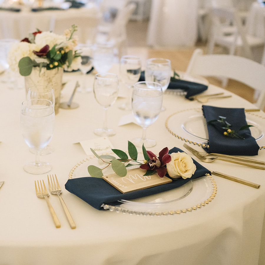 cherokee ranch wedding planning, colorado wedding inspiration, mountain wedding planning, reception decor details, navy and gold wedding colors, tented reception space, head table