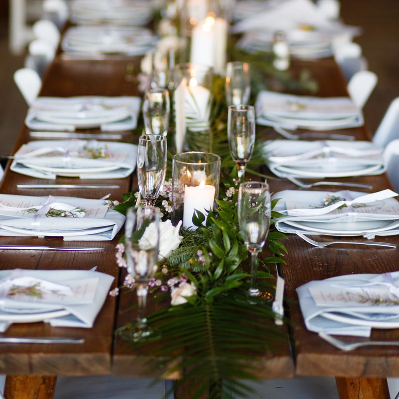 wedding mountain inspiration, beaver creek wedding planner, vail wedding planning, sweetly paired weddings, piney river ranch wedding reception venue space, long wooden tables, candles and greenery
