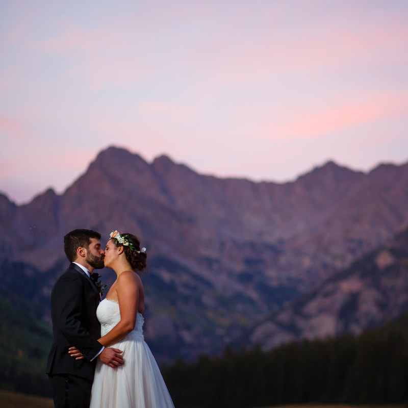 bride and groom kissing at sunset, flower crown, wedding mountain inspiration, beaver creek wedding planner, vail wedding planning, sweetly paired weddings, piney river ranch real wedding