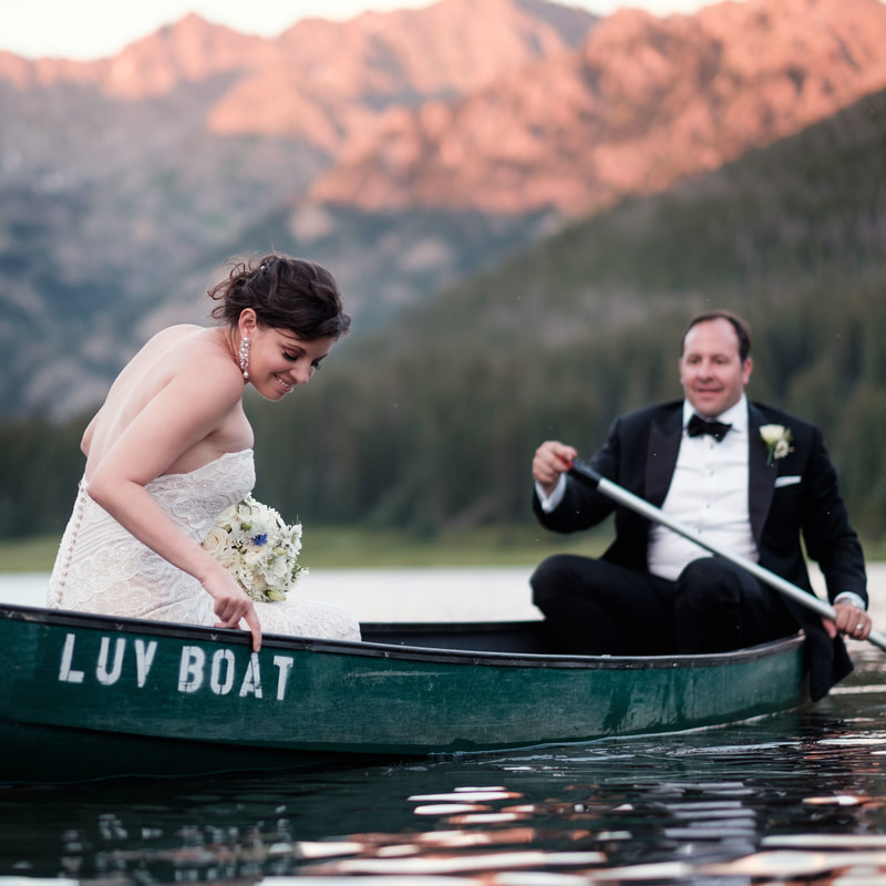 wedding mountain inspiration, beaver creek wedding planner, vail wedding planning, sweetly paired weddings, bride and groom in canoe named luv boat, black tie rustic chic glamping wedding
