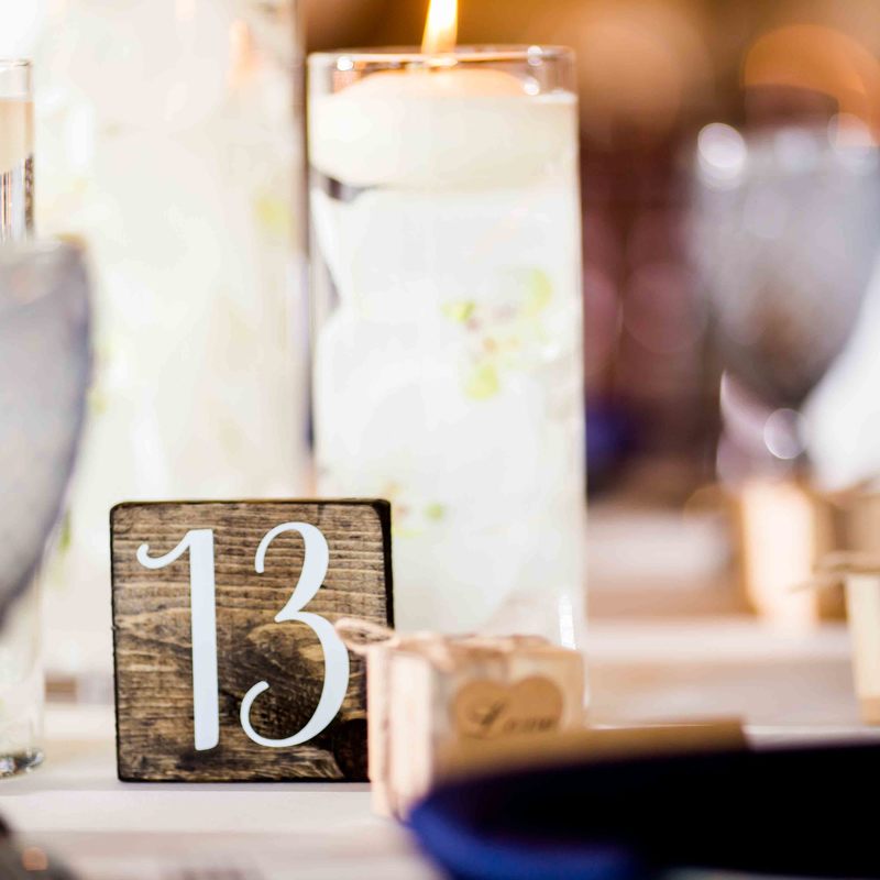 reception details, spruce mountain ranch, rustic chic, barn wedding, mountain wedding inspiration, navy plates, floating candle centerpieces, barn reception space, mountain wedding inspiration, sweetly paired wedding planner