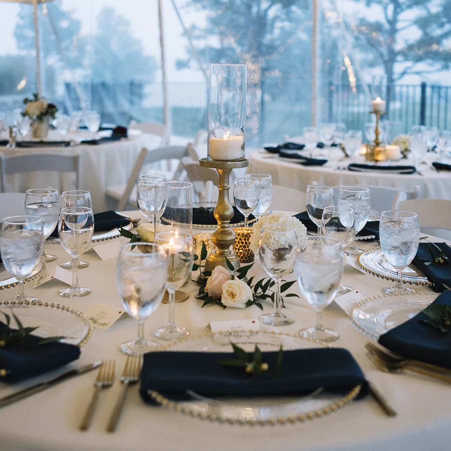 cherokee ranch wedding planning, colorado wedding inspiration, mountain wedding planning, reception decor details, navy and gold wedding colors, tented reception space, candle centerpiece