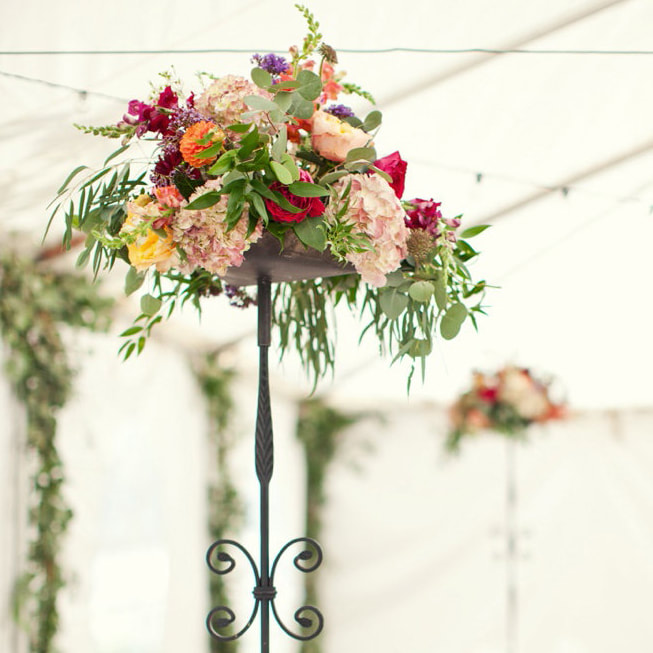 Reception venue, reception decor, table settings, wild horse inn wedding, winter park wedding planner, colorado wedding inspiration, sweetly paired wedding planning, floral centerpiece, mountain wedding inspiration, tall floral centerpieces, hanging greenery in tent