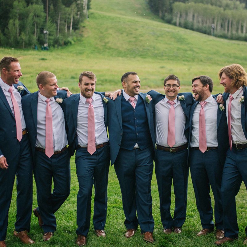 groomsmen portrait at beaver creek resort, blue suits with pink ties and brown leather dress shoes, group photo, wedding mountain inspiration, beaver creek wedding planner, vail wedding planning, sweetly paired weddings