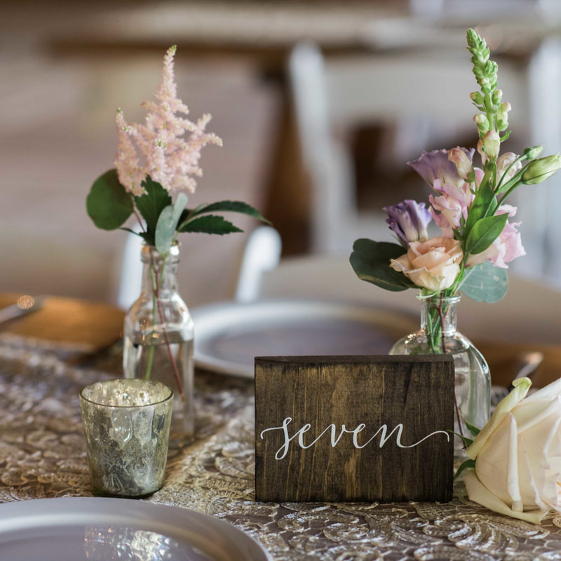 piney river ranch wedding reception, floral centerpieces, wooden table numbers, mountain wedding inspiration, vail wedding planners, beaver creek wedding planning