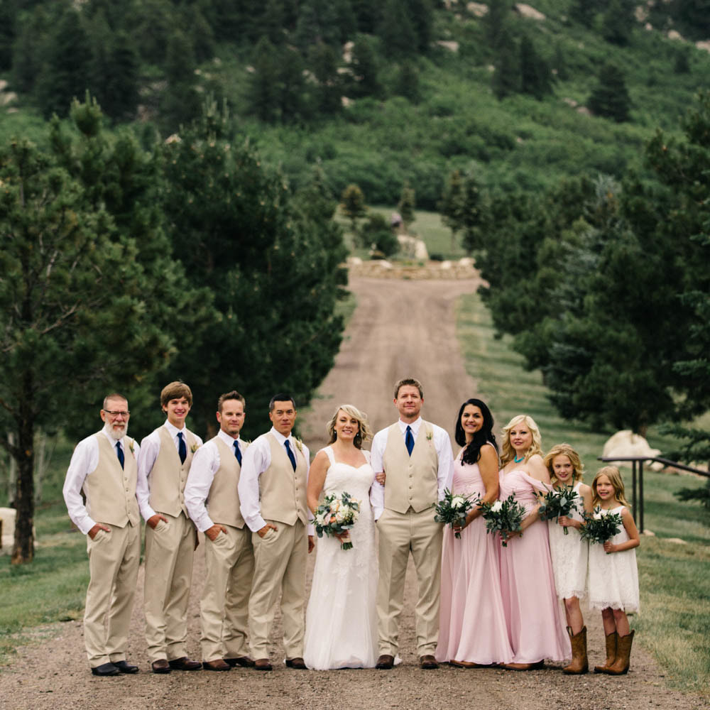 Wedding party photos, spruce mountain ranch wedding planner, summer wedding inspiration, colorado wedding planner, sweetly paired weddings, khaki suits and vests, navy ties, blush bridesmaids gowns, lace flower girl dresses, cowboy boots