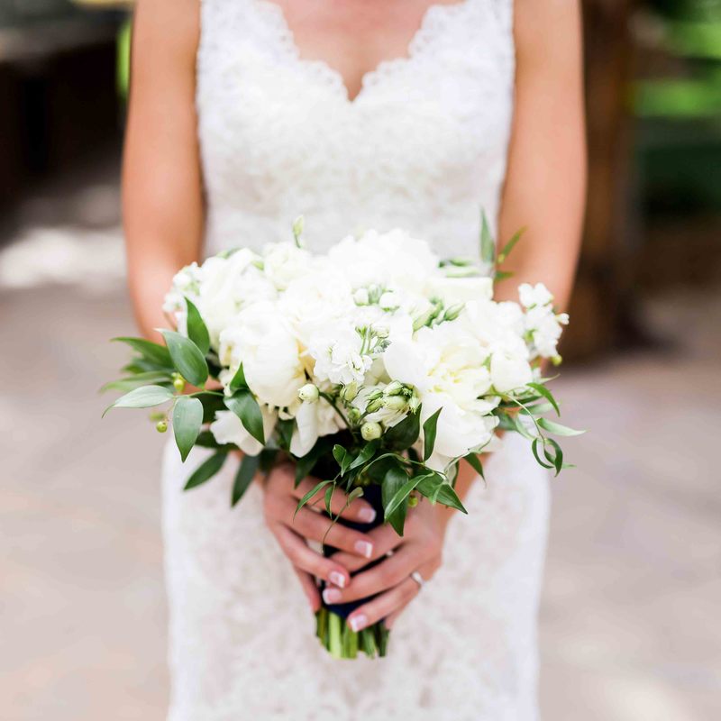 white and green bridal bouquet, wedding details, colorado wedding inspiration, spruce mountain ranch, real weddings, bride holding bouquet, mountain wedding planner
